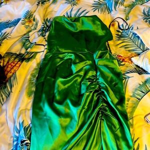 Silky green mid length rouged dress with open back